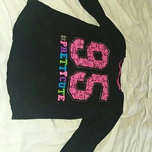 A black long sleeve shirt for kids.